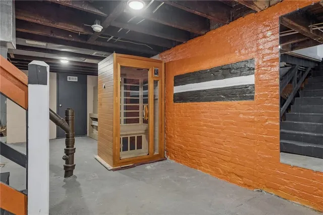 a view of an empty room with stairs