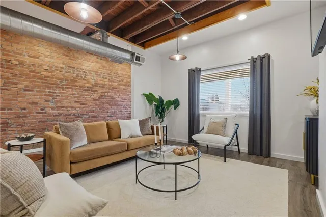 a living room with furniture and a table
