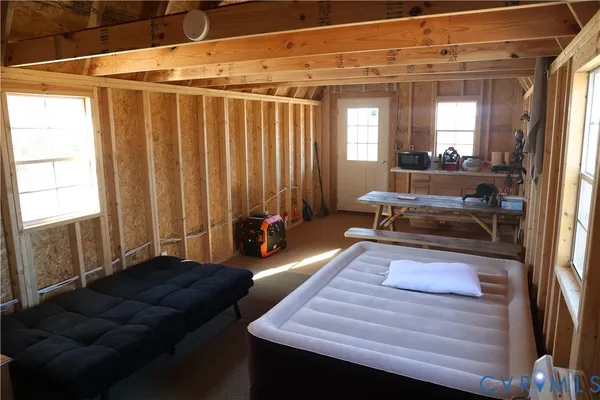 a living room with a couch and a chandelier