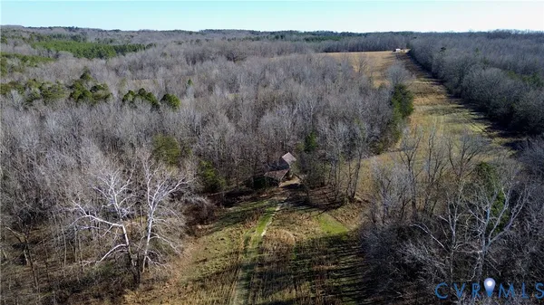 a view of a backyard with a small cabin