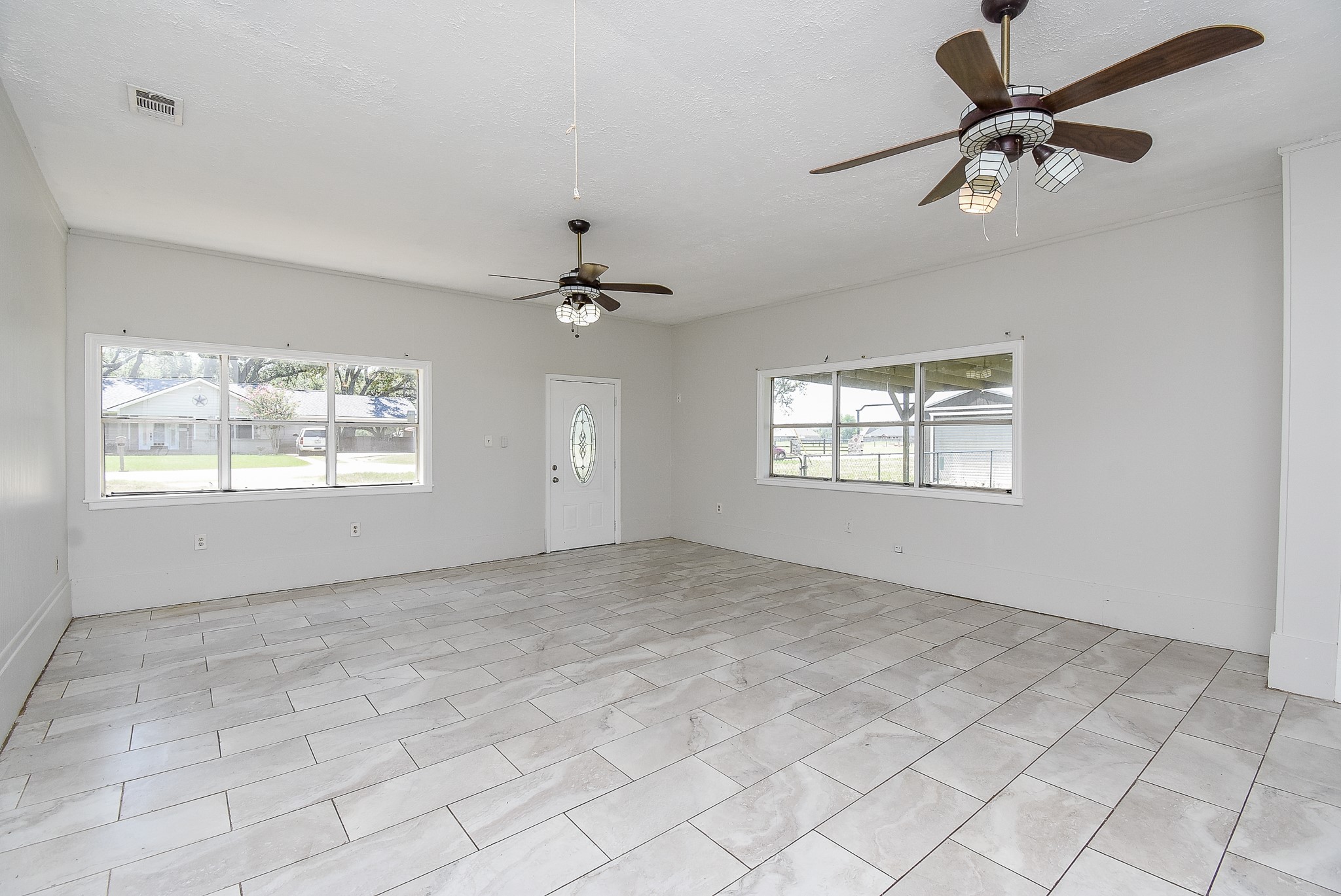 a view of an empty room with a window