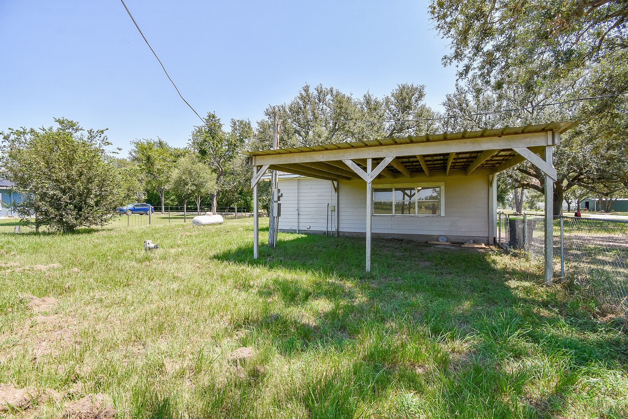 14235 Buffalo Street Needville, TX 77461 - Photo 21 of 21 a view of a yard with a house and garden