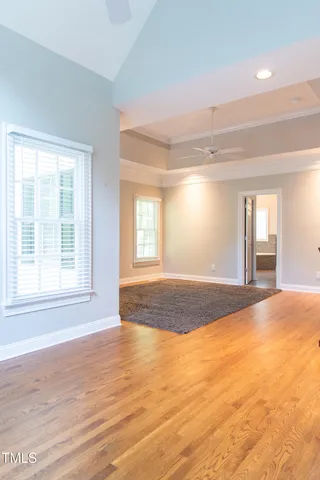 a view of a dining room with furniture wooden floor and chandelier