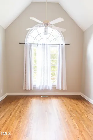 a bathroom with a tub a double vanity sink and mirror