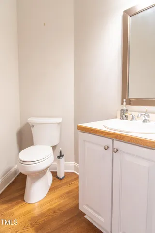 a kitchen with granite countertop white cabinets and a sink