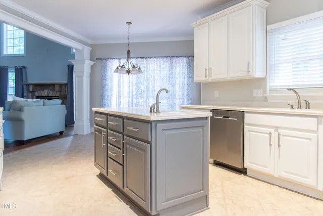 a view of an empty room with a ceiling fan