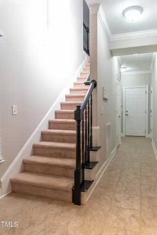 a view of a kitchen with white cabinets
