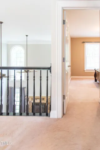 a spacious bedroom with a bed and a window