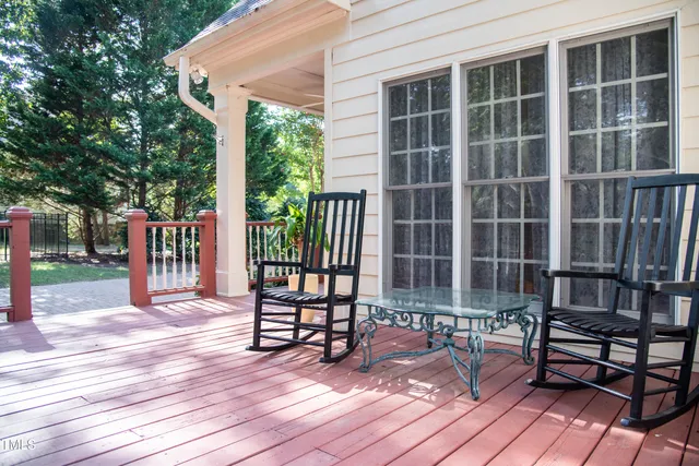 a backyard of a house with a large tree