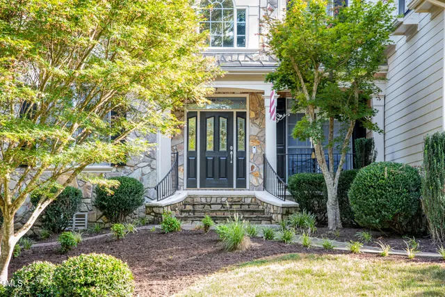 front view of a house with a garden