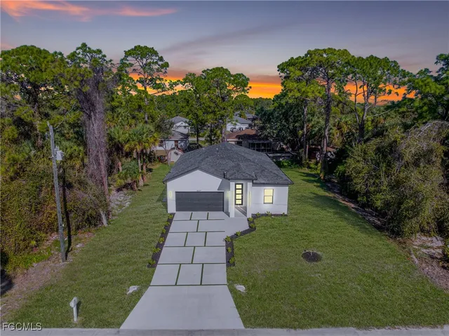 a aerial view of a house with a yard