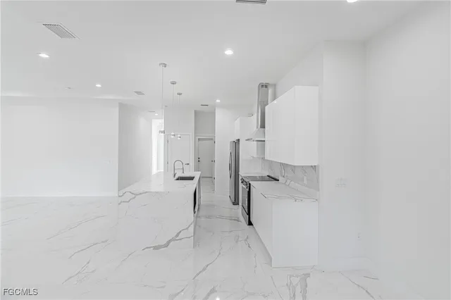 a view of a kitchen with a sink