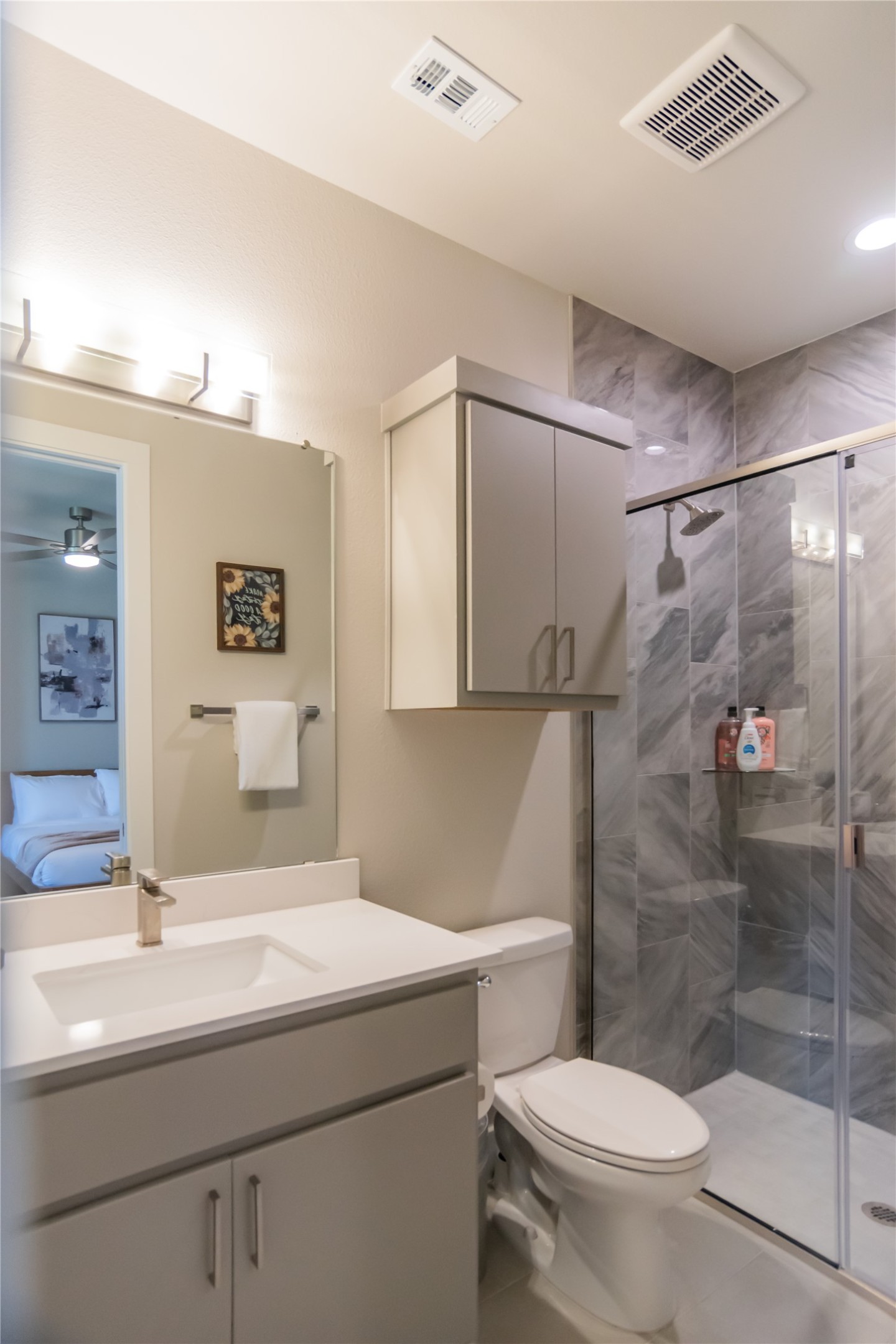13309 Morris Road, Unit 11 Austin, TX 78729 - Photo 12 of 31 A well-appointed bathroom with a spacious walk-in shower and ample vanity storage.
