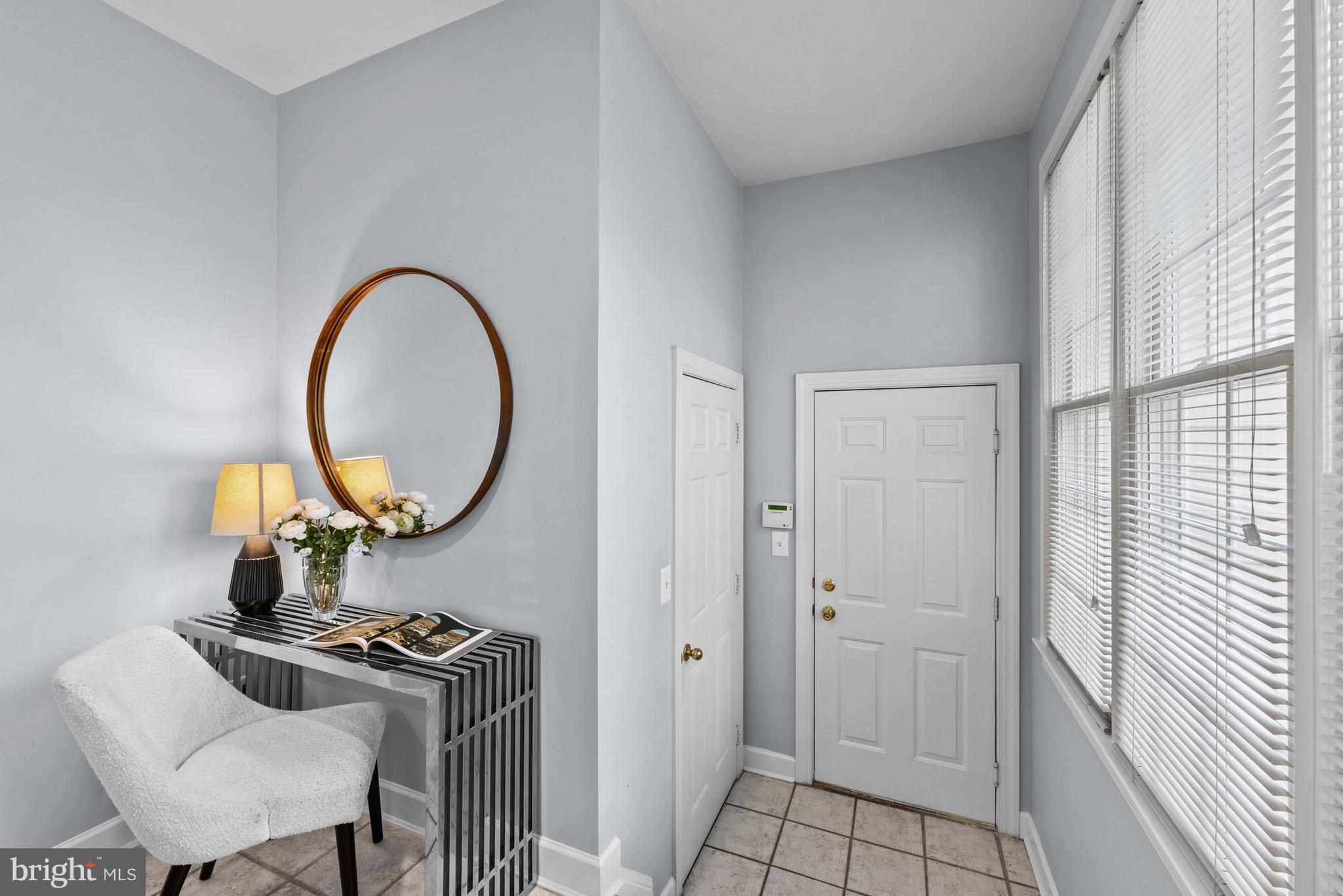 313 Hart Road Gaithersburg, MD 20878 - Photo 15 of 33 a living room with furniture and a mirror