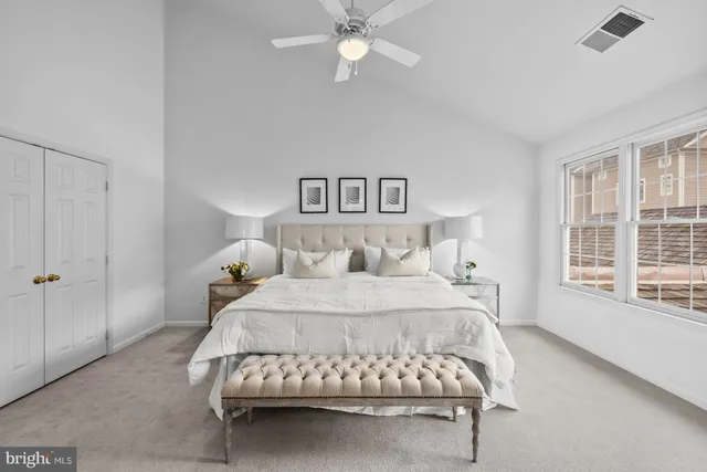 a bedroom with a bed and window