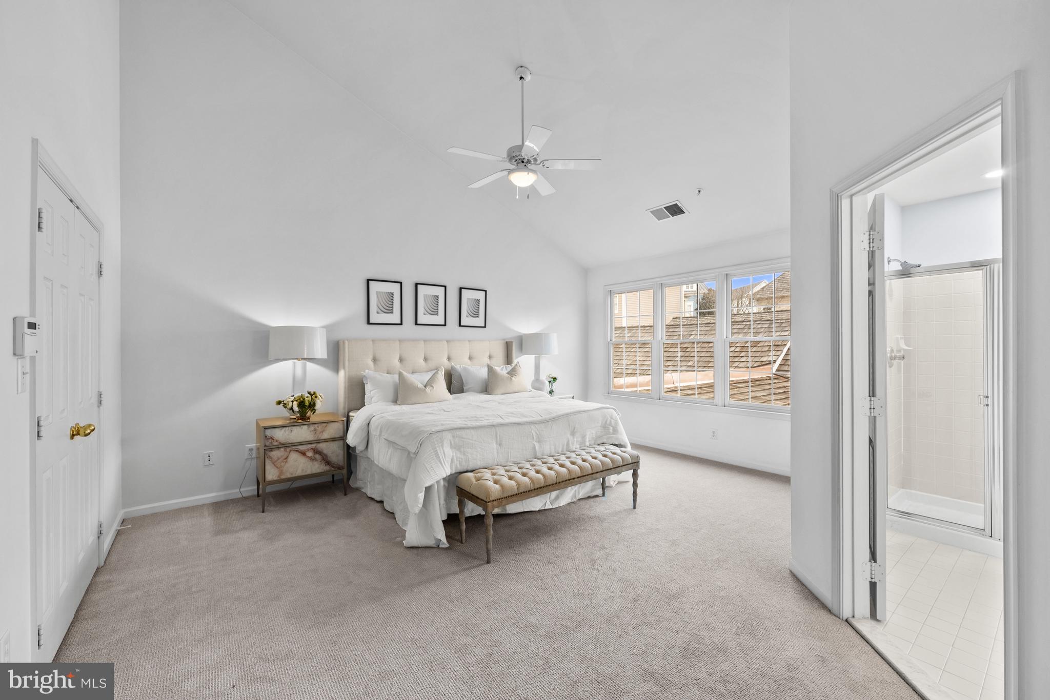 313 Hart Road Gaithersburg, MD 20878 - Photo 21 of 33 a spacious bedroom with a bed and a window
