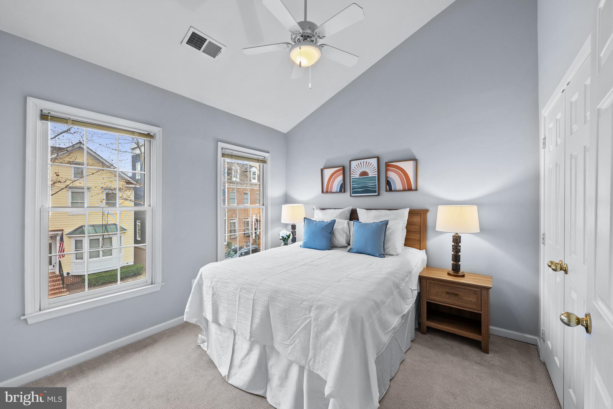 313 Hart Road Gaithersburg, MD 20878 - Photo 24 of 33 a bedroom with a bed and a lamp on dresser