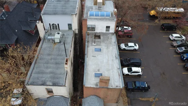 a front view of a house with wooden fence