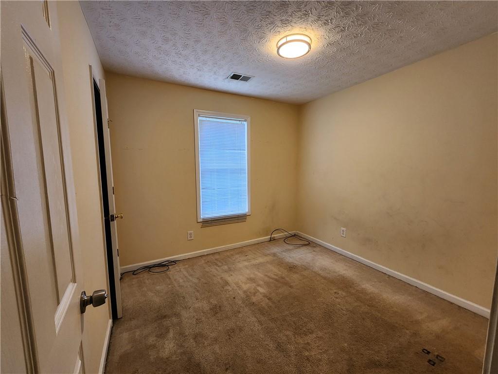 4170 Jewel Terrace Conley, GA 30288 - Photo 7 of 12 an empty room with windows