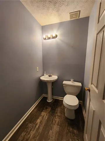 a bathroom with a toilet and a sink