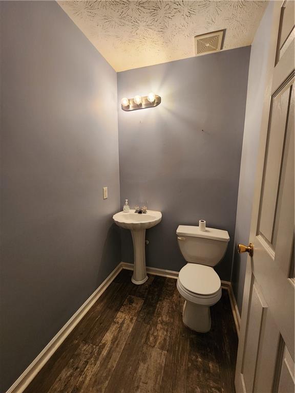 4170 Jewel Terrace Conley, GA 30288 - Photo 10 of 12 a bathroom with a toilet and a sink