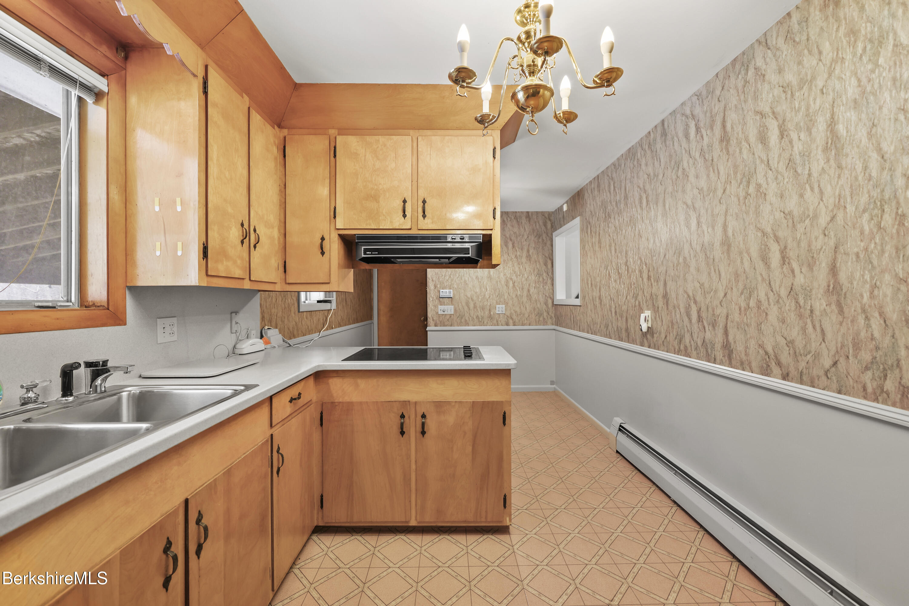89 Delancy Avenue Pittsfield, MA 01201 - Photo 12 of 40 a kitchen with a sink cabinets and window