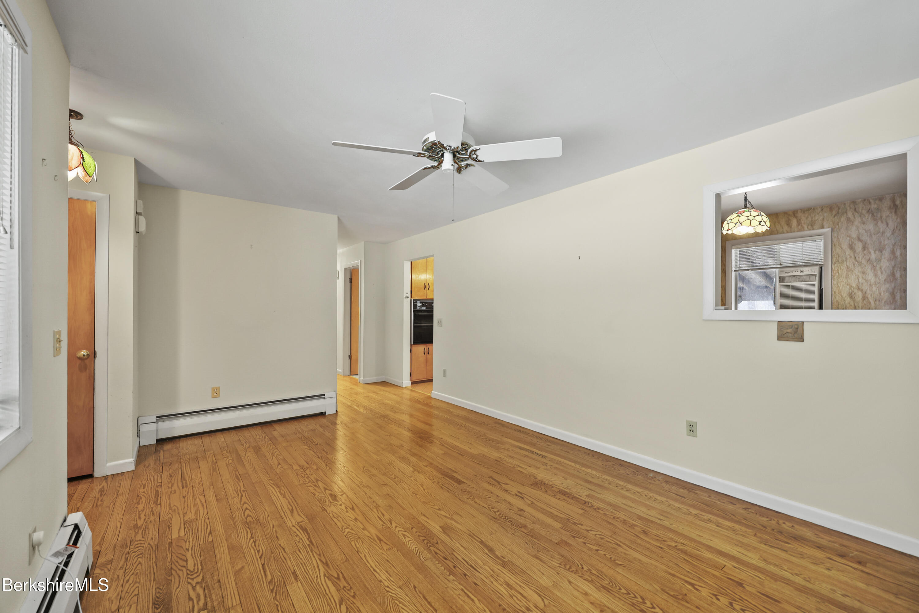 89 Delancy Avenue Pittsfield, MA 01201 - Photo 5 of 40 wooden floor in an empty room with a window