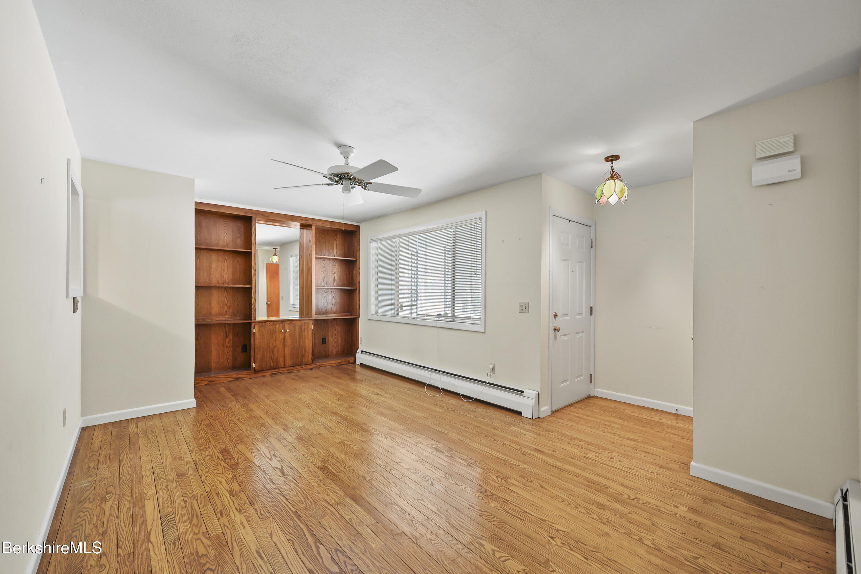 89 Delancy Avenue Pittsfield, MA 01201 - Photo 6 of 40 wooden floor in an empty room with a window