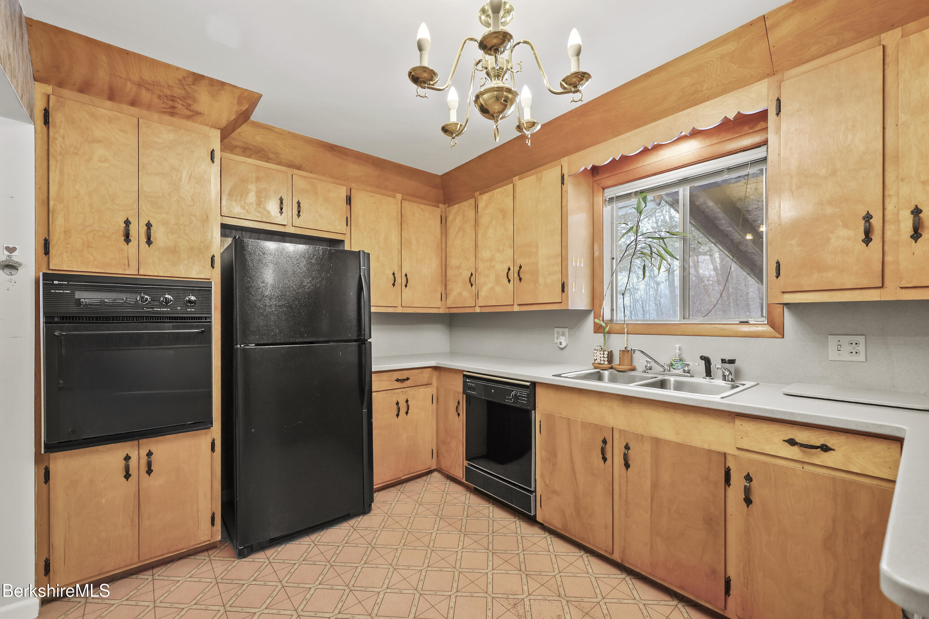 89 Delancy Avenue Pittsfield, MA 01201 - Photo 7 of 40 a kitchen with stainless steel appliances granite countertop a refrigerator a sink a stove and dishwasher