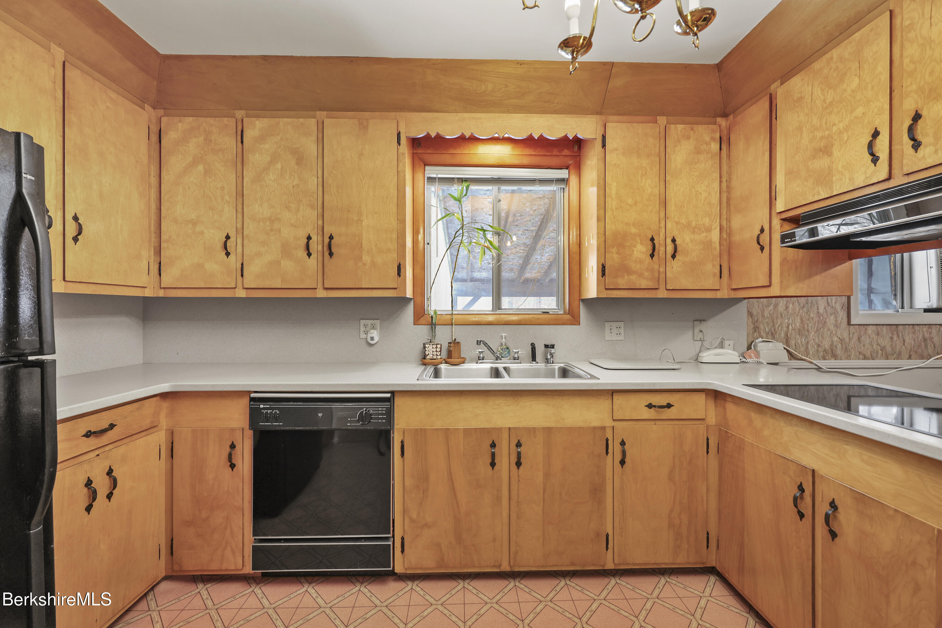 89 Delancy Avenue Pittsfield, MA 01201 - Photo 8 of 40 a kitchen with stainless steel appliances granite countertop a sink and cabinets with wooden floor