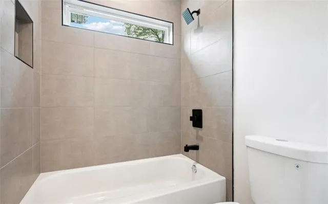 a bathroom with a white bath tub