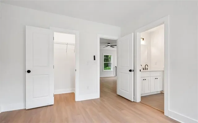 wooden floor with white walls