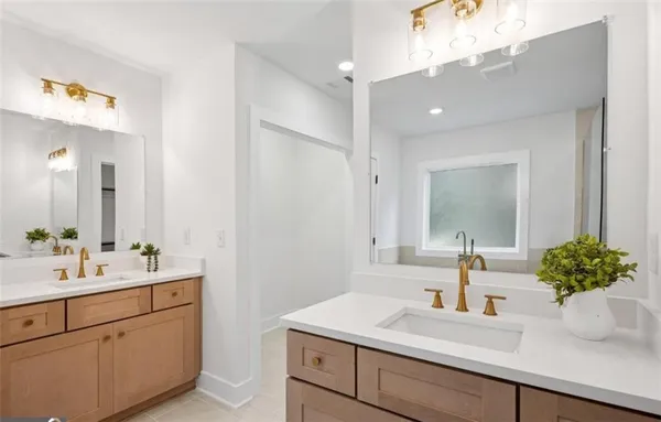 a bathroom with a sink a vanity and a mirror