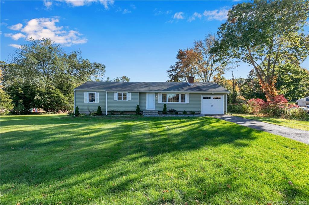 69 Old Tannery Road Monroe, CT 06468 - Photo 1 of 1 a front view of a house with a garden