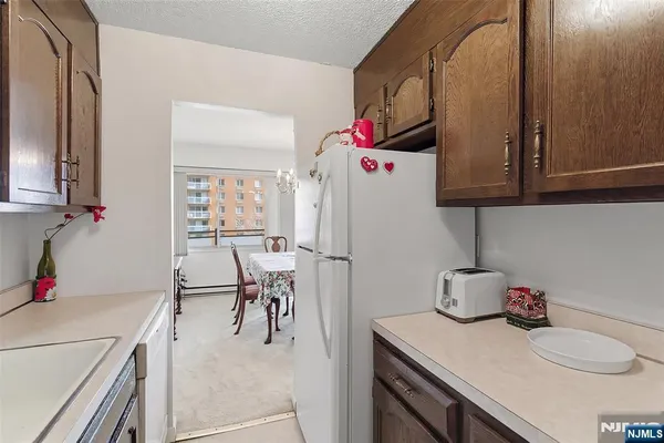 a kitchen with a sink cabinets and appliances