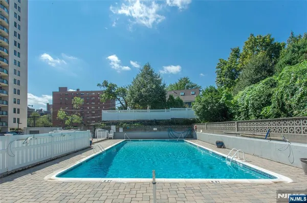 a view of a swimming pool and a patio