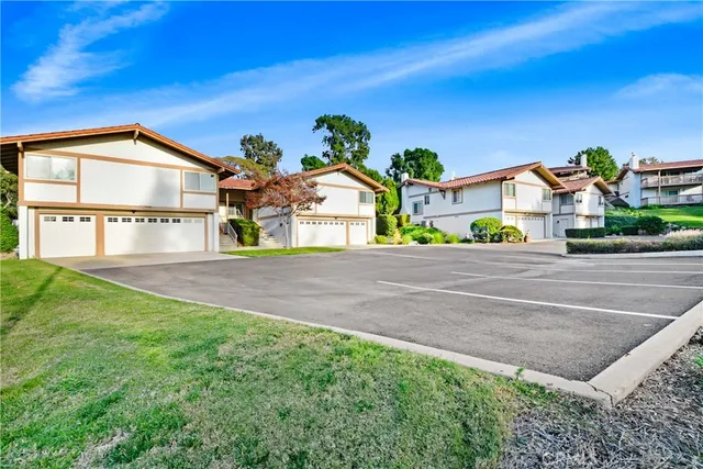a view of multiple houses with a yard