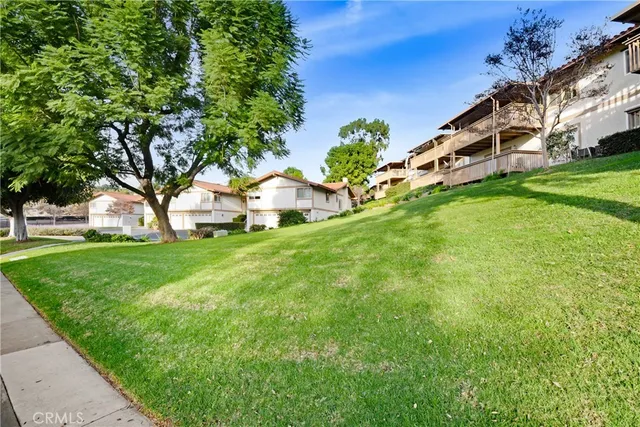a view of an house with backyard space and garden