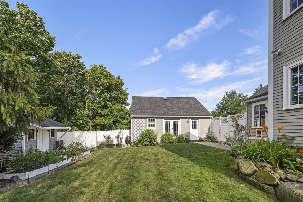 191 Centre Street Danvers, MA 01923 - Photo 31 of 40 a front view of a house with a yard