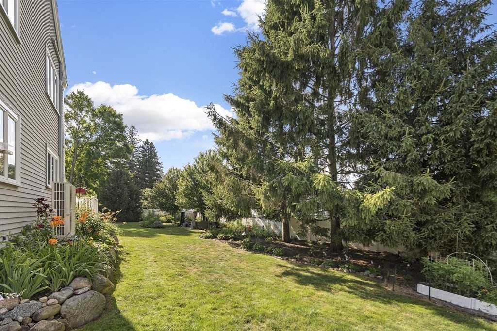 191 Centre Street Danvers, MA 01923 - Photo 32 of 40 a view of yard with swimming pool and seating space