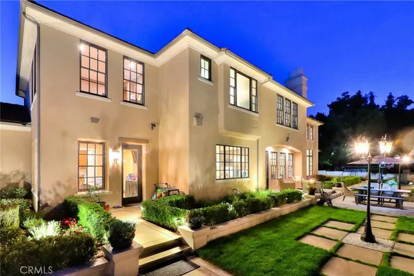 a view of a patio with table and chairs and potted plants