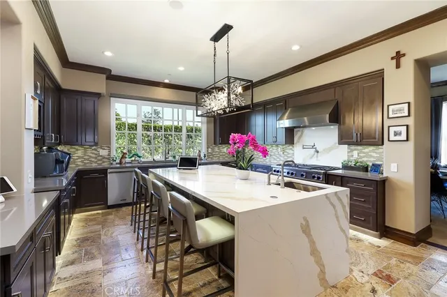 a bathroom with a glass shower door and a sink
