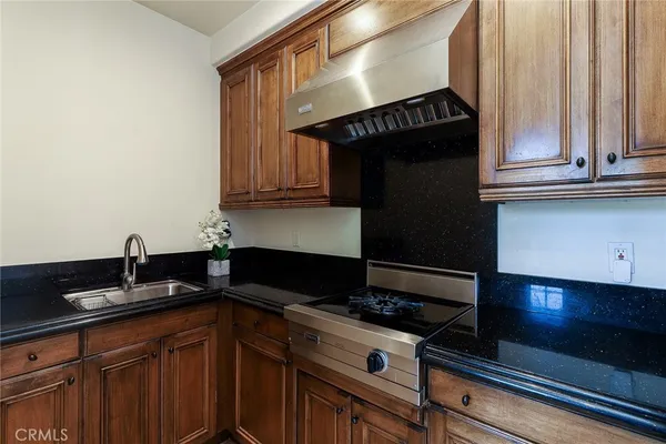 a living room with furniture a fireplace and a large window