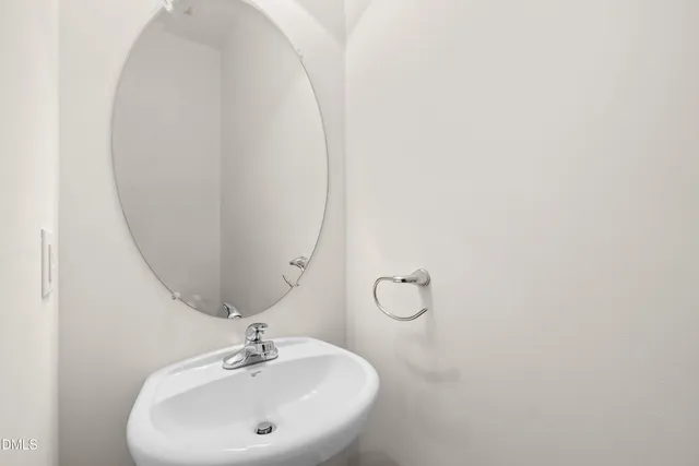 a large kitchen with stainless steel appliances granite countertop a sink a stove a refrigerator a microwave and island with wooden cabinets