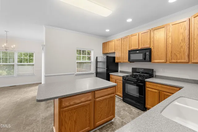 a kitchen with microwave and stove