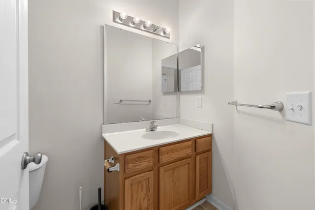 a bathroom with a shower curtain and a window