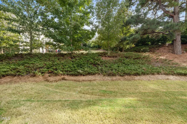 a view of a house with wooden deck