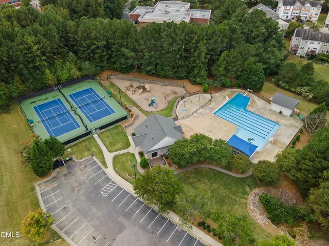 an aerial view of a house with a swimming pool