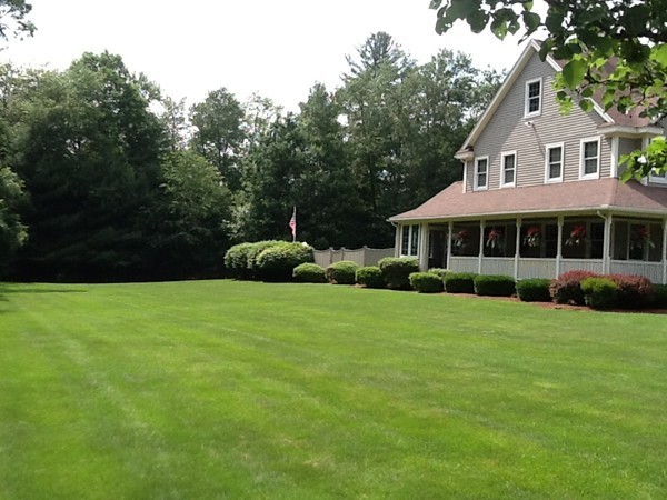 5 Parker Road Mendon, MA 01756 - Photo 2 of 28 a front view of a house with a garden