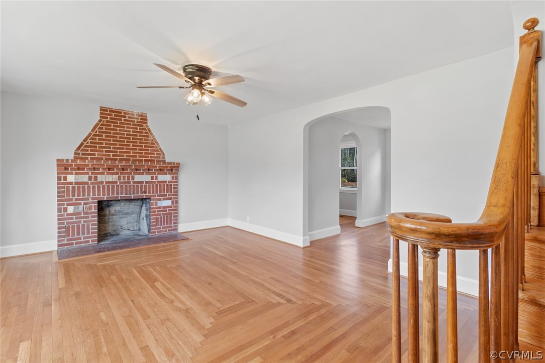 369 Main Street Reedville, VA 22539 - Photo 11 of 44 wooden floor in an empty room with a fireplace